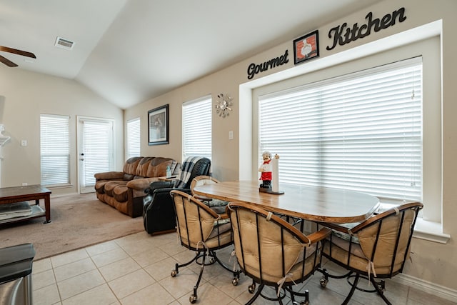 602 Tumbleweed Dr, Forney, TX 75126 - dining room with light tile patterned flooring, vaulted ceiling, a ceiling fan, and light carpet