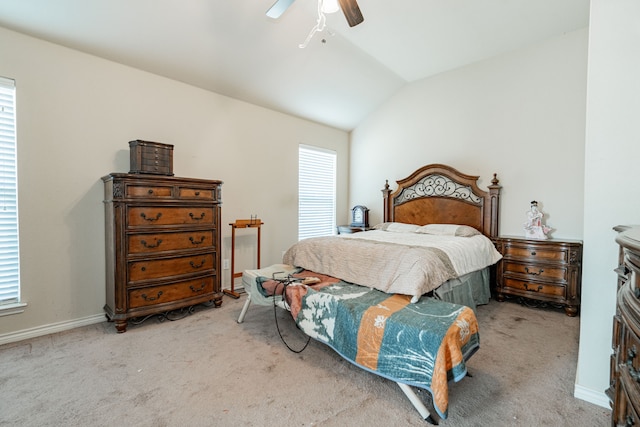 bedroom with lofted ceiling, light carpet, multiple windows, and ceiling fan