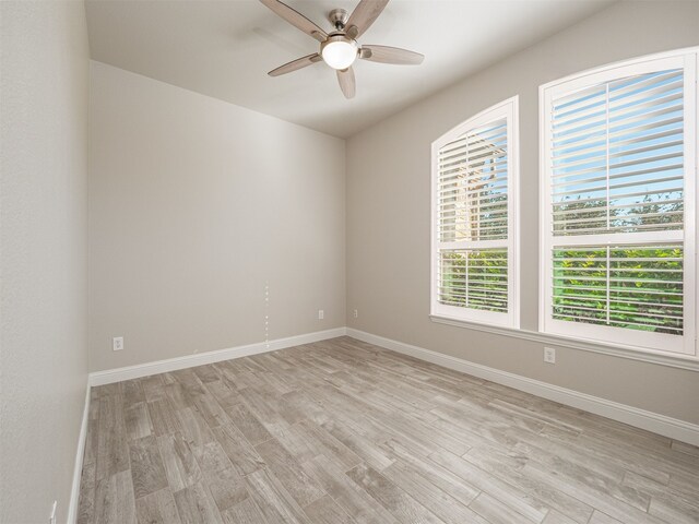 unfurnished room with ceiling fan and light hardwood / wood-style flooring