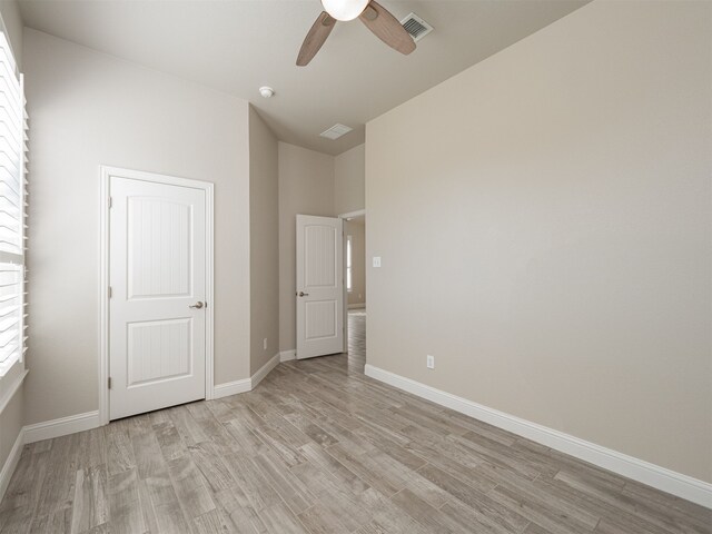 unfurnished bedroom featuring ceiling fan and light hardwood / wood-style flooring