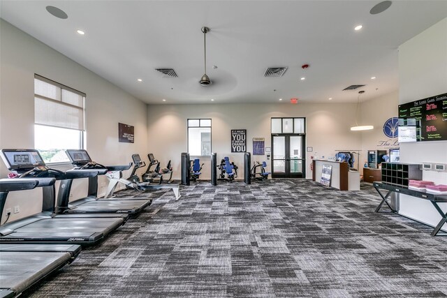 gym with carpet floors and french doors