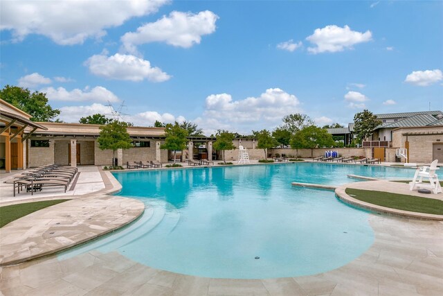 view of pool featuring a patio