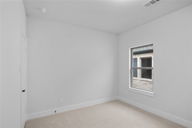 empty room featuring light carpet