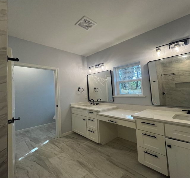 bathroom featuring vanity, a shower, and toilet