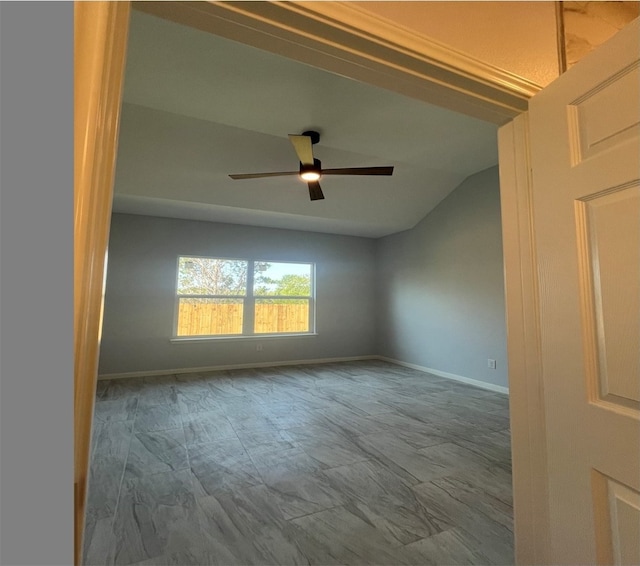 unfurnished room featuring ceiling fan and lofted ceiling