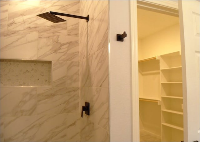 bathroom with tiled shower