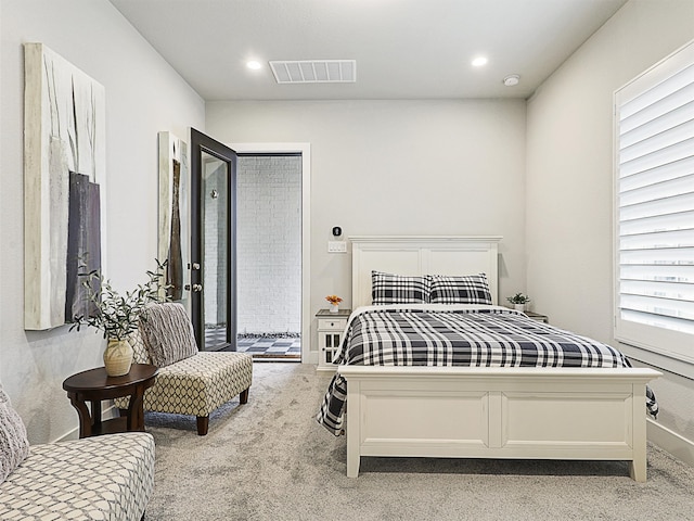 carpeted bedroom featuring access to outside