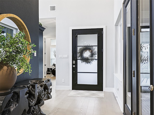 foyer with light hardwood / wood-style floors