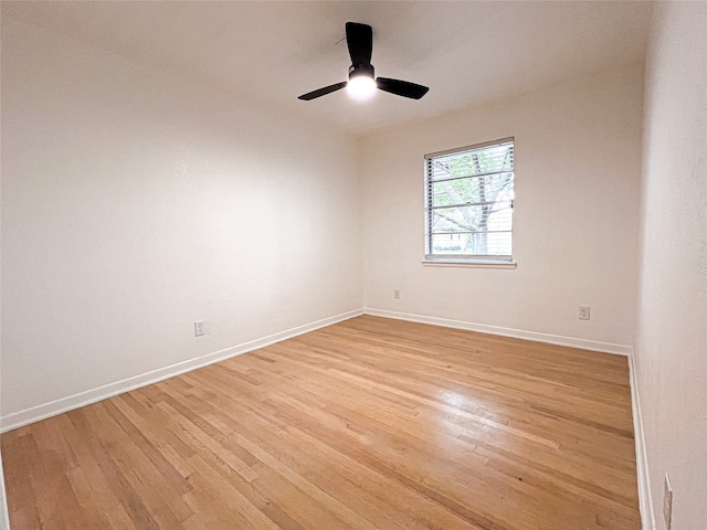 spare room with light hardwood / wood-style flooring and ceiling fan