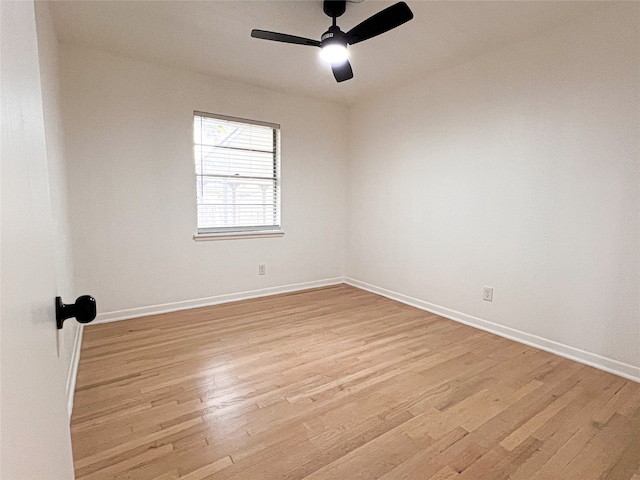 spare room featuring light hardwood / wood-style flooring and ceiling fan