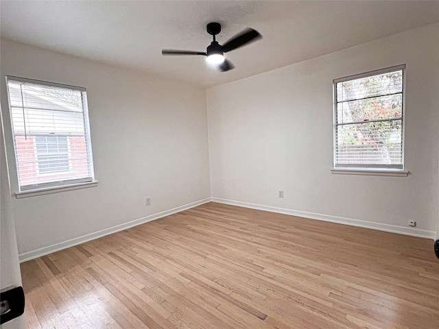 spare room featuring light hardwood / wood-style flooring and ceiling fan