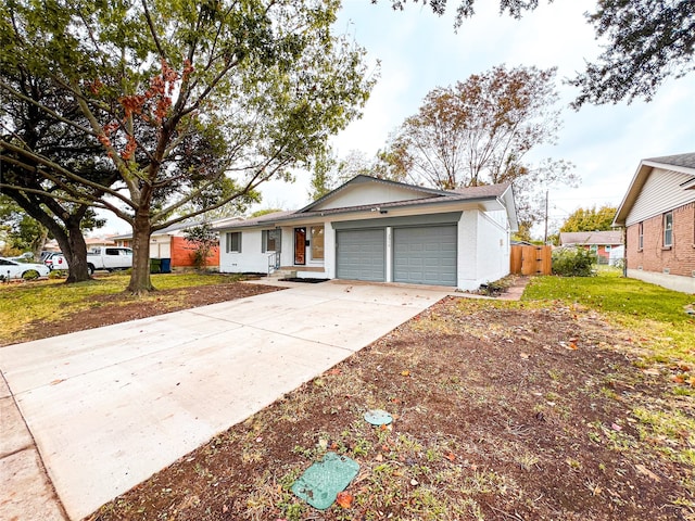 view of front of house with a front yard and a garage