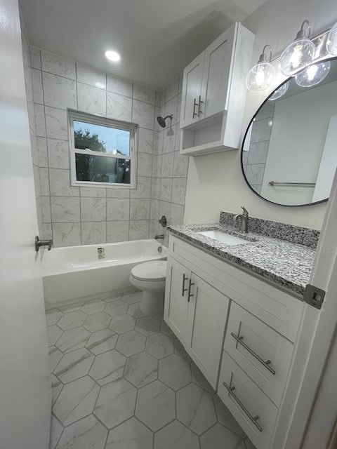 full bathroom with toilet, tiled shower / bath combo, and vanity