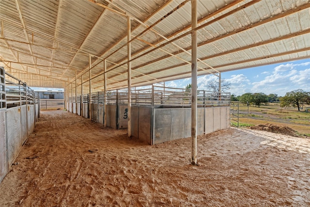 view of horse barn featuring a rural view