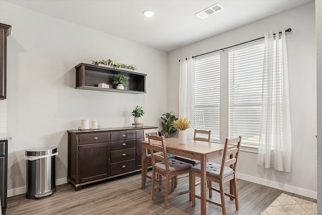 dining room featuring wood-type flooring