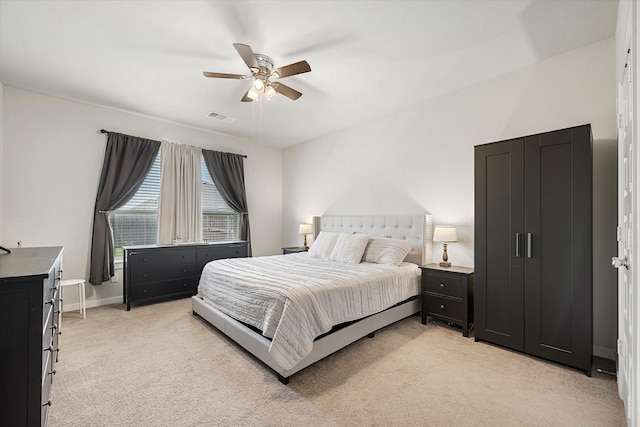 carpeted bedroom with ceiling fan