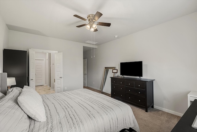 carpeted bedroom with ceiling fan