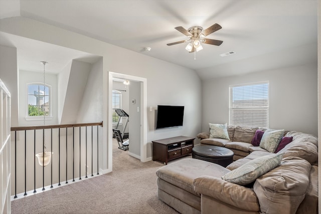 carpeted living room featuring lofted ceiling and ceiling fan