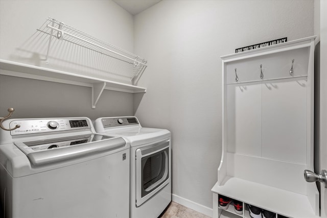 washroom featuring washer and clothes dryer