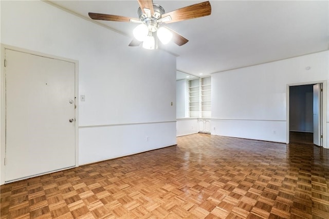 unfurnished room with parquet floors and ceiling fan