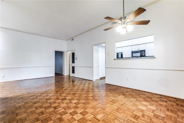 unfurnished room with light parquet flooring and ceiling fan