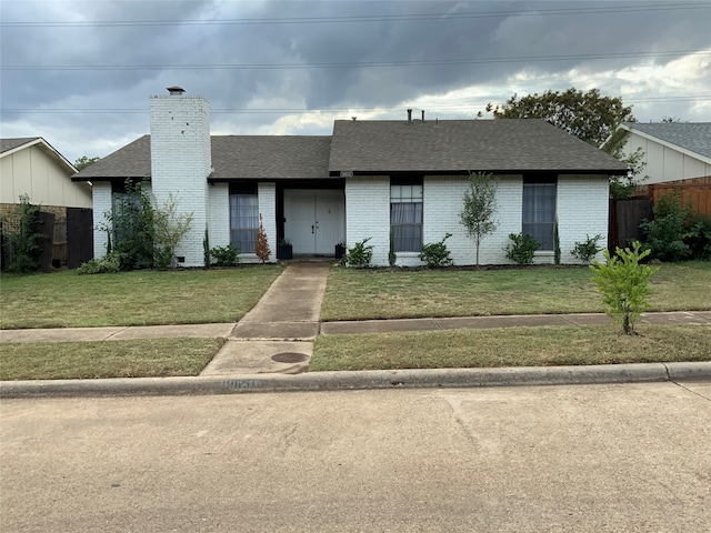 view of front of home with a front yard