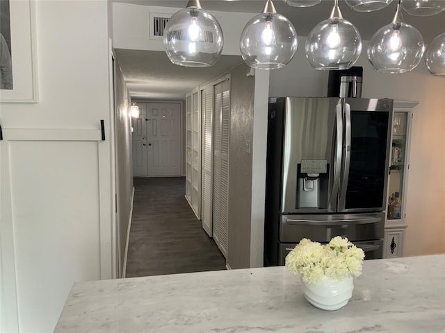 hallway with dark hardwood / wood-style floors