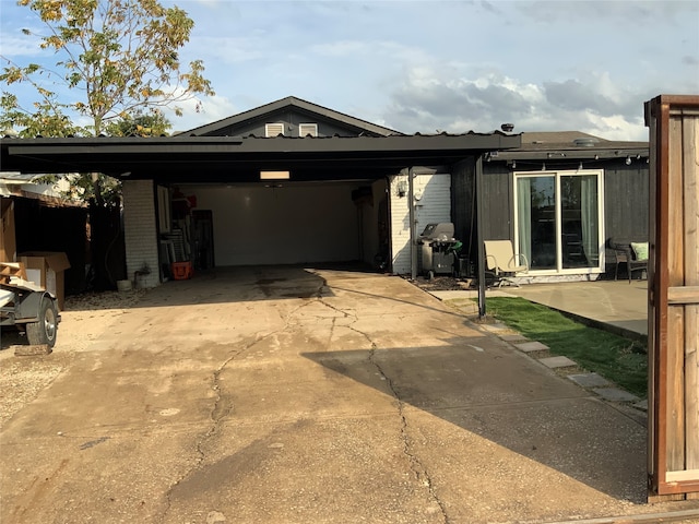 view of front of property with a carport