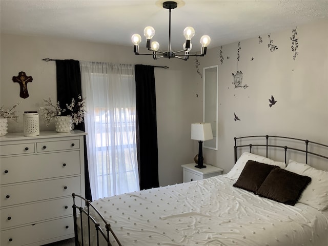 bedroom featuring an inviting chandelier