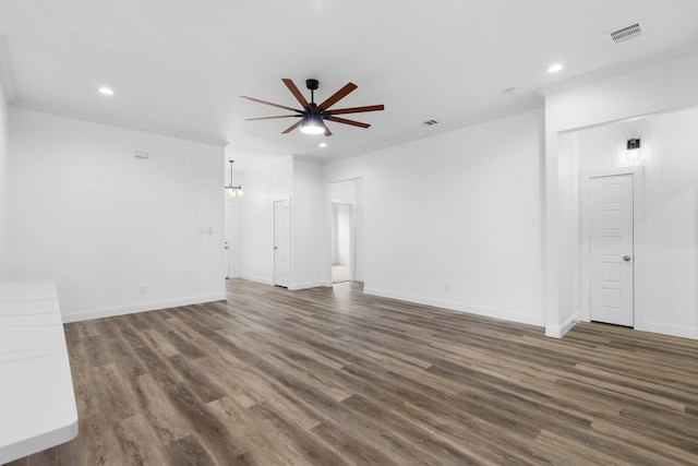 unfurnished living room featuring dark hardwood / wood-style floors, ceiling fan, and crown molding