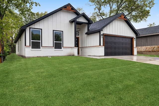 modern inspired farmhouse with a front yard and a garage