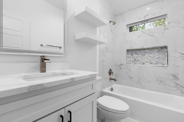 full bathroom featuring vanity, toilet, and tiled shower / bath