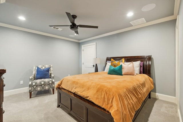 carpeted bedroom featuring ceiling fan and crown molding