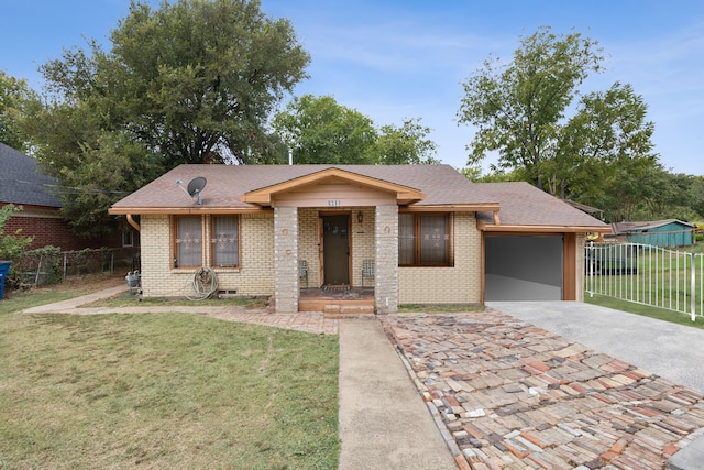 view of front of property with a garage and a front yard