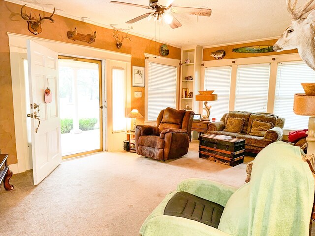 living room with ceiling fan and carpet flooring