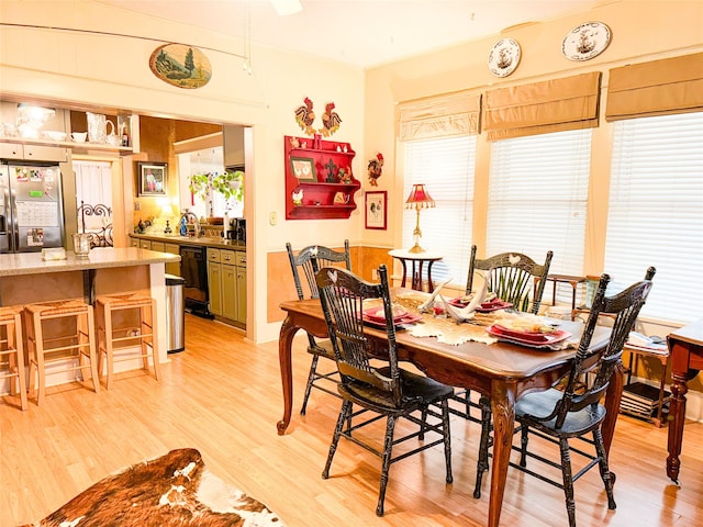 dining space with light wood-type flooring