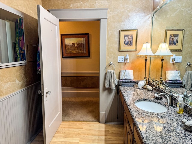 bathroom featuring vanity and hardwood / wood-style flooring