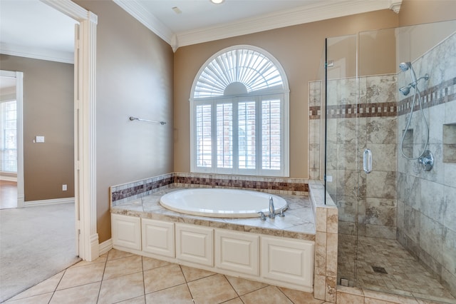 bathroom featuring crown molding, tile patterned floors, a wealth of natural light, and separate shower and tub