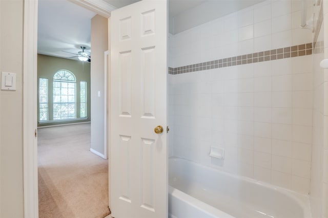 bathroom with tiled shower / bath combo and ceiling fan