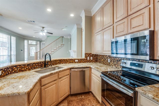 kitchen with sink, stainless steel appliances, crown molding, decorative backsplash, and light brown cabinets