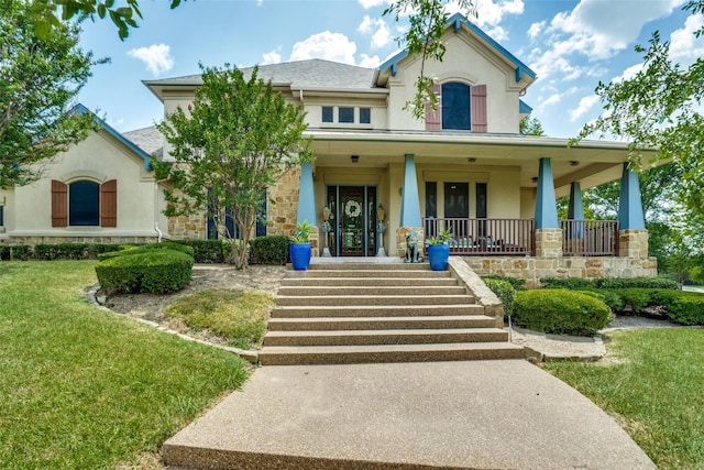 view of front of house with a front lawn and covered porch