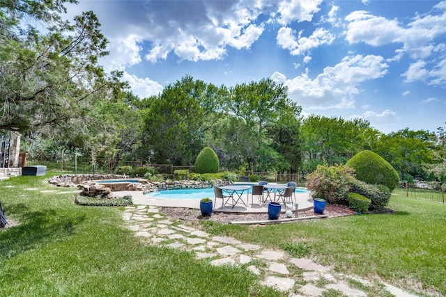 view of pool featuring a patio area and a lawn