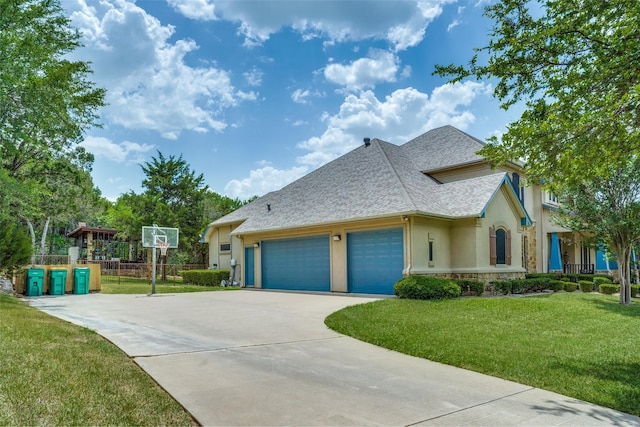 view of front of property with a front lawn and a garage