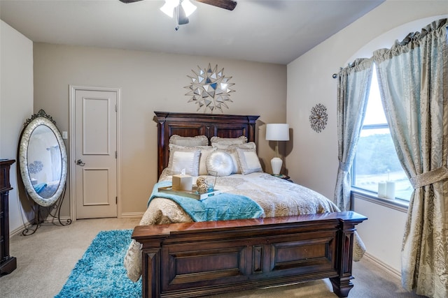 bedroom featuring ceiling fan and light colored carpet