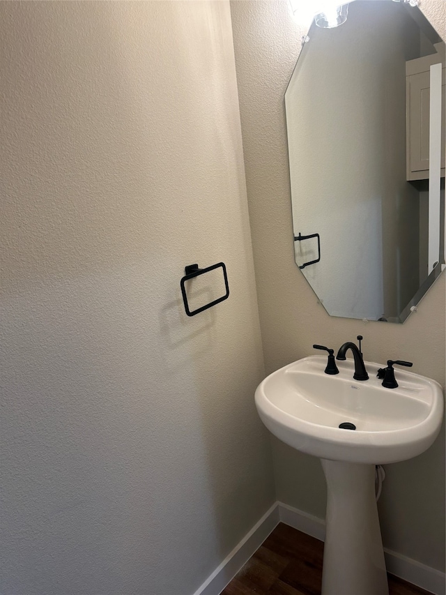 bathroom featuring hardwood / wood-style floors and sink