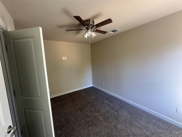 empty room featuring carpet floors and ceiling fan