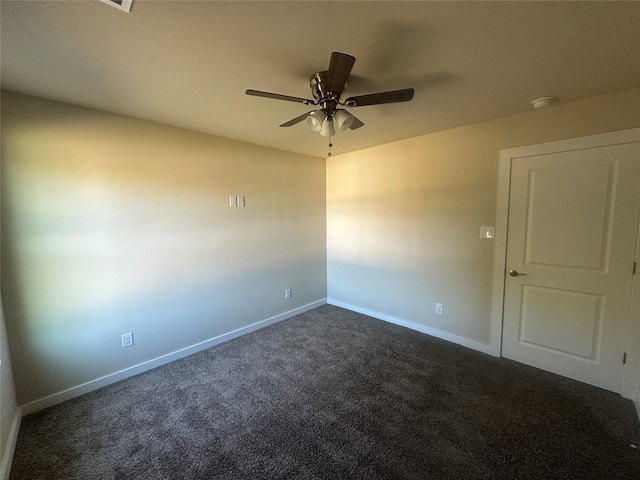 carpeted empty room with ceiling fan