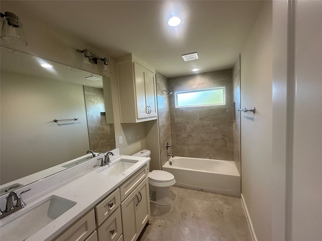 full bathroom with tiled shower / bath, toilet, and vanity