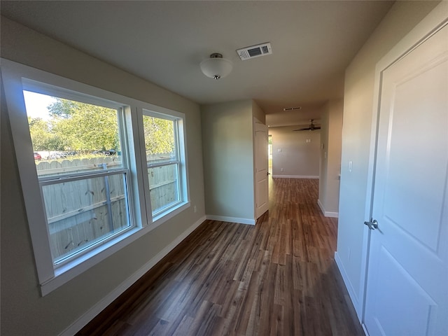 hall with dark hardwood / wood-style flooring