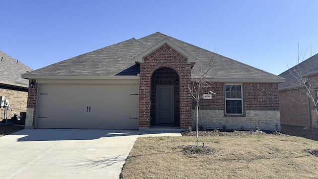 single story home with a garage, concrete driveway, and brick siding